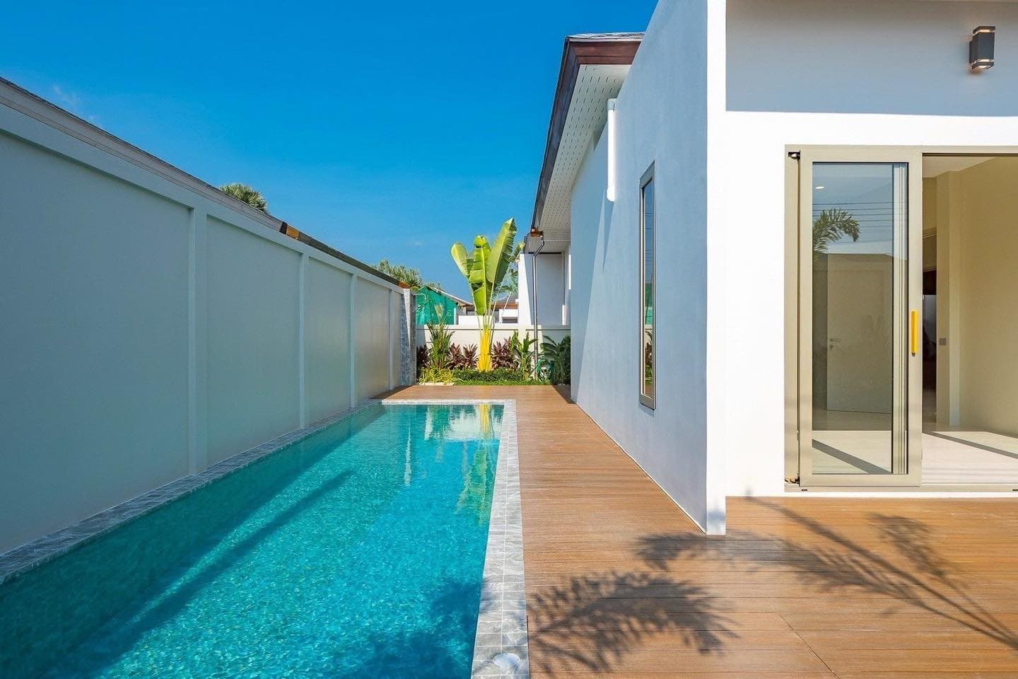 Lap pool beside a modern villa in Thalang
